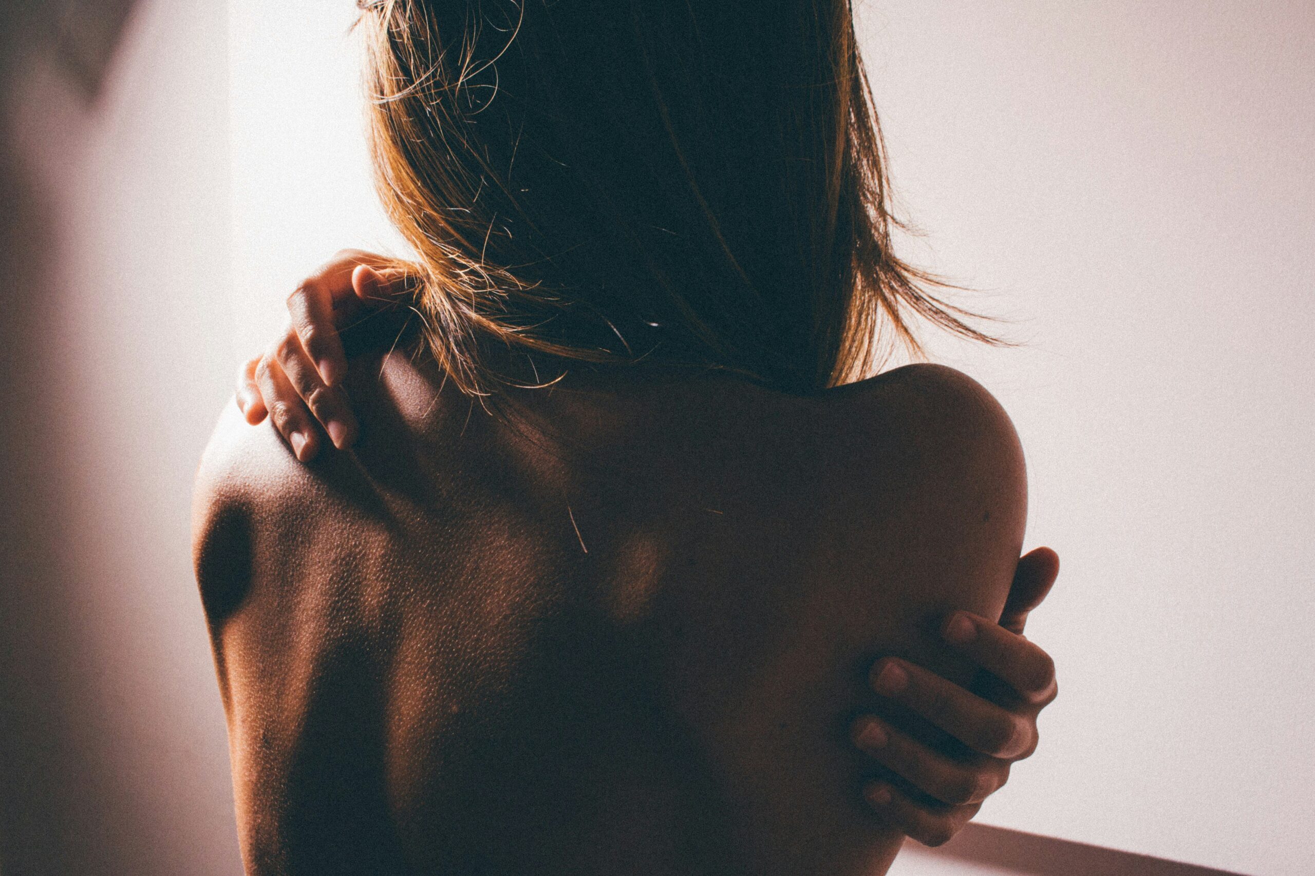 Photo of a woman hugging herself