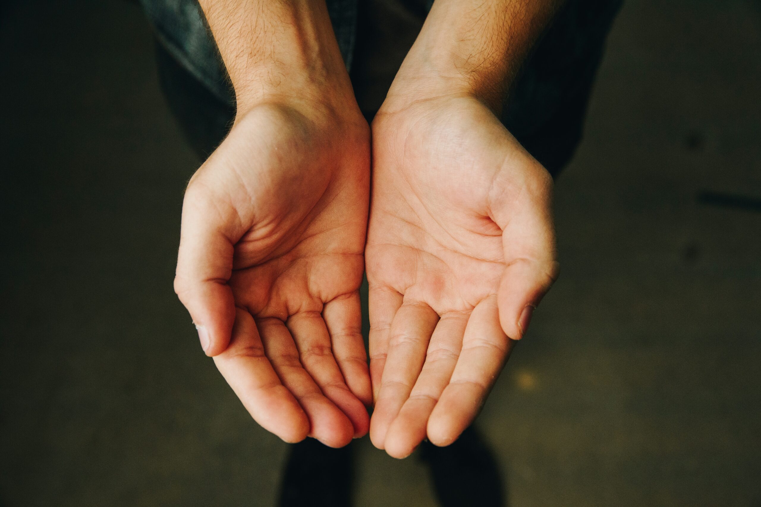 Photo showing two hands together palms open